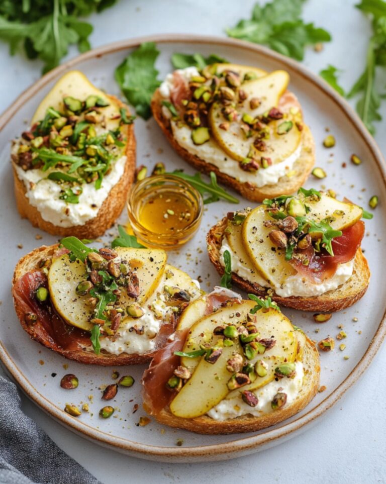 Ricotta and Pear Crostini with Salty Pumpkin Seed Pistachio Crunch 